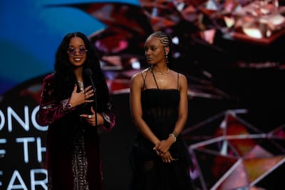 In this handout photo courtesy of CBS Broadcasting, H.E.R. with Tiara Thomas accept the award for Song of the Year onstage during the 63rd Annual GRAMMY Awards at Los Angeles Convention Center on March 14, 2021 in Los Angeles, California.  - RESTRICTED TO EDITORIAL USE - MANDATORY CREDIT "AFP PHOTO / Cliff LIPSON / CBS Broadcasting, Inc." - NO MARKETING NO ADVERTISING CAMPAIGNS - DISTRIBUTED AS A SERVICE TO CLIENTS --- NO ARCHIVE ---

 / AFP / CBS Broadcasting, Inc. / CBS Broadcasting, Inc. / CBS Broadcasting, Inc. / CLIFF LIPSON / RESTRICTED TO EDITORIAL USE - MANDATORY CREDIT "AFP PHOTO / Cliff LIPSON / CBS Broadcasting, Inc." - NO MARKETING NO ADVERTISING CAMPAIGNS - DISTRIBUTED AS A SERVICE TO CLIENTS --- NO ARCHIVE ---

