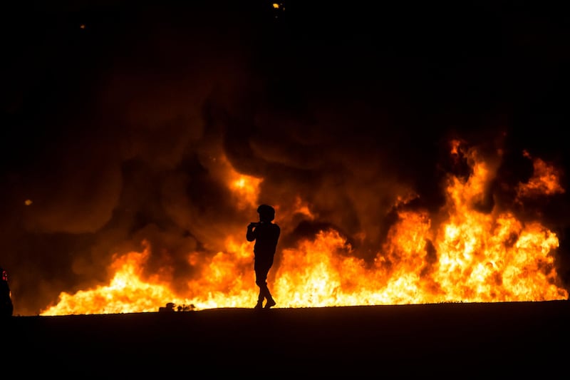 A field blazes after an explosion in Ramla, Israel, caused by a rocket launched from Gaza on Thursday night. Amir Levy/Getty Images