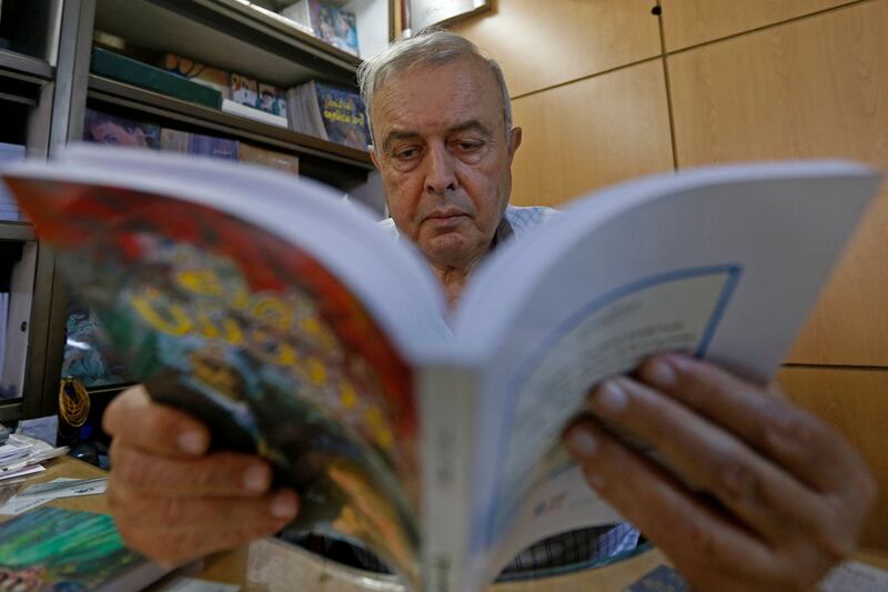 Khalil Haddad reads a book at the Dar Oussama publishing house. Books have become a 'luxury' for Syrians.