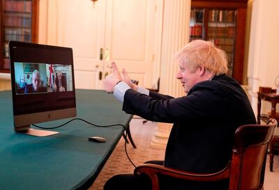 A handout image released by 10 Downing Street, shows Britain's Prime Minister Boris Johnson (R) speaking to 102 year old war veteran Ernie Horsfall, from the cabinet room inside 10 Downing Street on the 75th anniversary of VE Day (Victory in Europe Day), the end of the Second World War in Europe, in central London on May 8, 2020.  - RESTRICTED TO EDITORIAL USE - MANDATORY CREDIT "AFP PHOTO / 10 DOWNING STREET / ANDREW PARSONS" - NO MARKETING - NO ADVERTISING CAMPAIGNS - DISTRIBUTED AS A SERVICE TO CLIENTS
 / AFP / 10 Downing Street / Andrew PARSONS / RESTRICTED TO EDITORIAL USE - MANDATORY CREDIT "AFP PHOTO / 10 DOWNING STREET / ANDREW PARSONS" - NO MARKETING - NO ADVERTISING CAMPAIGNS - DISTRIBUTED AS A SERVICE TO CLIENTS
