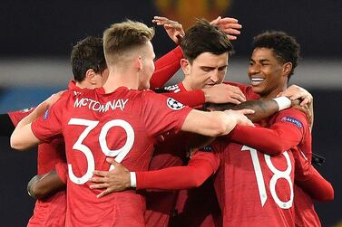 Manchester United striker Marcus Rashford (R) celebrates scoring against Leipzig at Old Trafford. AFP