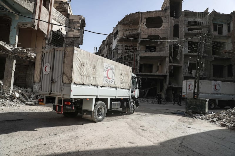 A convoy of Syrian Arab Red Crescent (SARC)  trucks arrive in Douma, in Eastern Ghouta, Syria, on March 5,  2018. Mohammed Badra / EPA