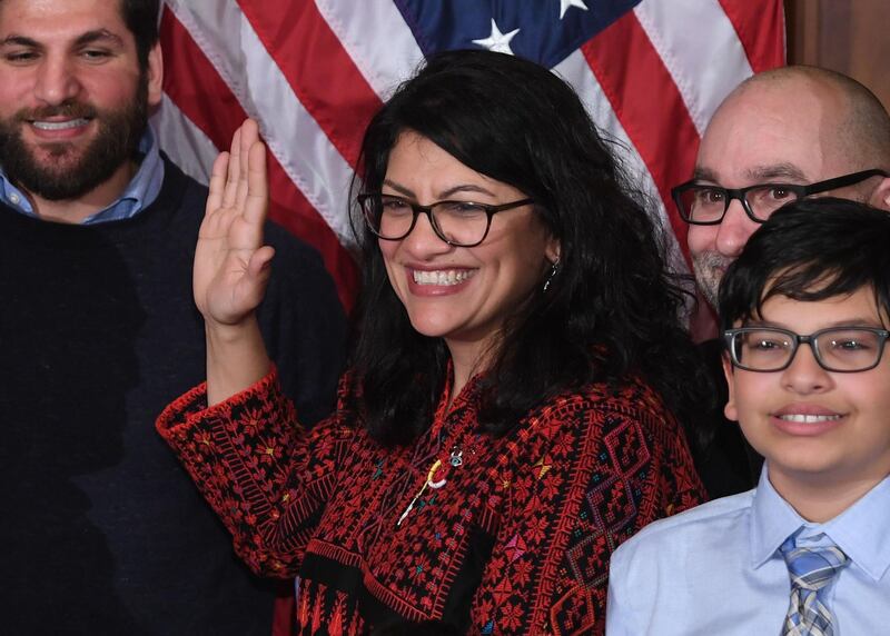 (FILES) In this file photo taken on January 3, 2019, US House Representative Rashida Tlaib participates in a ceremonial swearing-in at the start of the 116th Congress at the US Capitol in Washington, DC. Tlaib kicked off her term with an expletive-laced vow to impeach President Donald Trump, triggering Republican outrage and testing party discipline barely a day after Democrats regained the House. / AFP / SAUL LOEB
