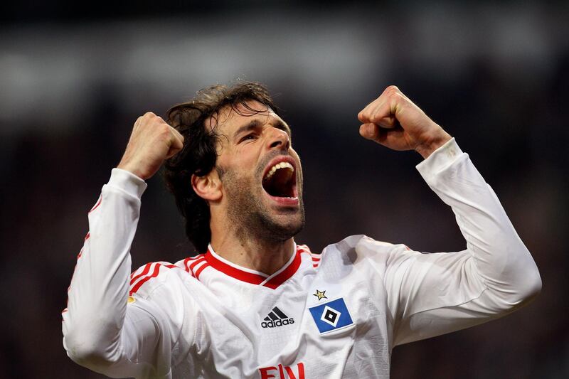 BRUSSELS, BELGIUM - MARCH 18:  Ruud van Nistelrooy of Hamburg celebrates his team's third goal scored by his team mate Mladen Petric during the UEFA Europa League round of 16 second leg match between RSC Anderlecht and Hamburger SV at Constant Vanden Stock Stadium on March 18, 2010 in Brussels, Belgium.  (Photo by Vladimir Rys/Bongarts/Getty Images)