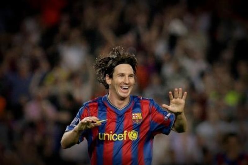 Barcelona's Argentinian forward Lionel Messi celebrates after scoring during the UEFA Champions League football match between Barcelona and Dynamo Kiev at the Camp Nou stadium in Barcelona on September 29, 2009. AFP PHOTO/JOSEP LAGO.