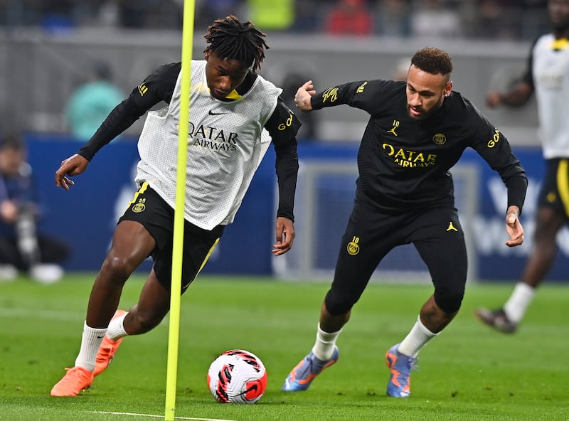 Neymar and Timothee Pembele during PSG's training session in Qatar. EPA