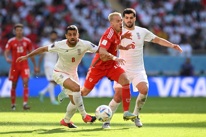 Aaron Ramsey of Wales battles for possession against Iran. Getty
