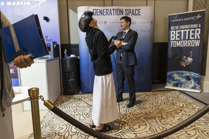 Abu Dhabi Secondary School student Majid Senbol, 16, explores Mars with virtual reality goggles.  Antonie Robertson / The National