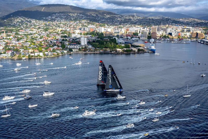 Yachts Law Connect and Andoo Comanche near the finish line of the annual Sydney to Hobart yacht race in Hobart. AFP