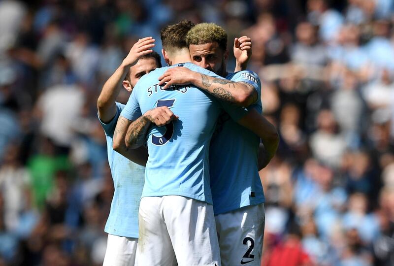 Manchester City's Kyle Walker celebrates with John Stones following their Premier League match against Tottenham Hotspur. Getty Images
