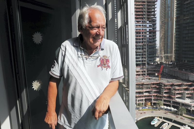 DUBAI , UNITED ARAB EMIRATES , December 11  ��� 2018 :- John Felton, a retired lawyer who is now a children���s author at his apartment at the Cayan Tower  in Dubai Marina in Dubai. ( Pawan Singh / The National ) For Business. Story by David