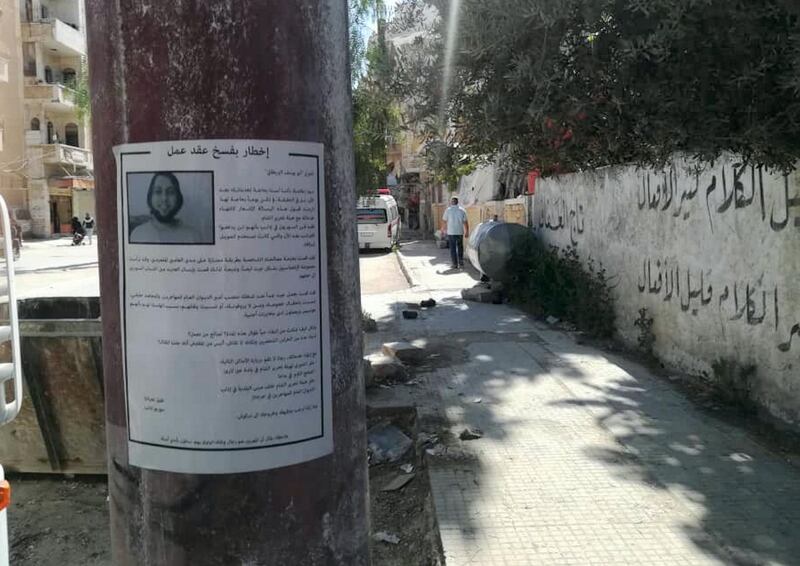A wanted poster is seen in Idlib, Syria.