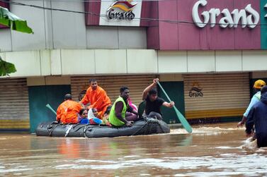 Rescuers evacuate residents at Aluva after heavy floods acroos the south Indian state of Kerala. AFP