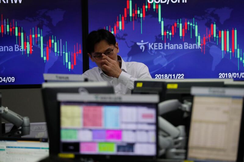 epa07257824 A South Korean dealer works in front of monitors at the KEB Hana Bank in Seoul, South Korea, 02 January 2019. The benchmark South Korea Composite Stock Price Index (KOSPI) plummeted 31.04 points or 1.52 percent to close at 2,010 on 02 January.  EPA/JEON HEON-KYUN