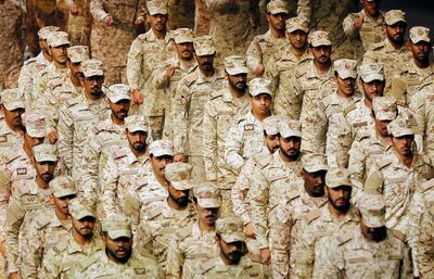 Saudi soldiers parade during a concert titled "mettle to the top" at the green hall theatre marking Saudi 89th National Day celebrations in Riyadh, Saudi Arabia, late Saturday, Sept. 21, 2019. (AP Photo/Amr Nabil)