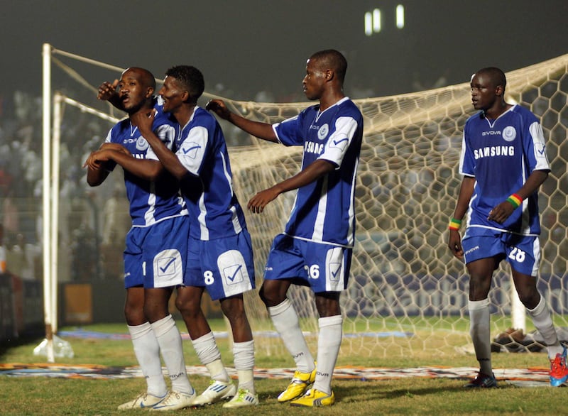 Sudanese al-Hilal players celebrate a goal by Edward Sadomba against Sudan's al-Ahly Shandy club during their match for the CAF Confederation Cup on October 5, 2012 in Omdurman. AFP PHOTO/EBRAHIM HAMID