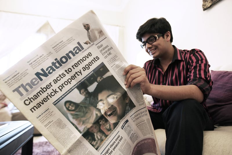 SHARJAH , UNITED ARAB EMIRATES Ð Feb 27 : Nabeel Kamran ( 17 years old ) looking the copy of The National newspaper at his home in Sharjah. His story about organ transplant was published on the front page in this copy in 2008. ( Pawan Singh / The National ) For News. Story by Mitya Underwood

