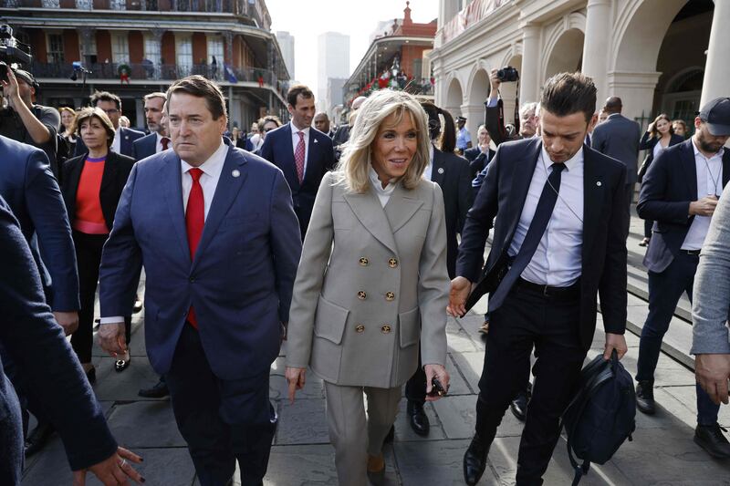 Ms Macron joined her husband for a portion of the walk.  AFP