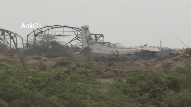 Remains of shelled plane are seen near the airport.