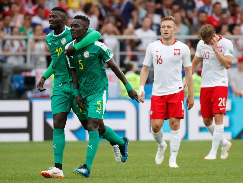 epaselect epa06821556 Idrissa Gueye (2-L) of Senegal celebrates with team mates the 1-0 lead during the FIFA World Cup 2018 group H preliminary round soccer match between Poland and Senegal in Moscow, Russia, 19 June 2018.

(RESTRICTIONS APPLY: Editorial Use Only, not used in association with any commercial entity - Images must not be used in any form of alert service or push service of any kind including via mobile alert services, downloads to mobile devices or MMS messaging - Images must appear as still images and must not emulate match action video footage - No alteration is made to, and no text or image is superimposed over, any published image which: (a) intentionally obscures or removes a sponsor identification image; or (b) adds or overlays the commercial identification of any third party which is not officially associated with the FIFA World Cup)  EPA/FELIPE TRUEBA   EDITORIAL USE ONLY