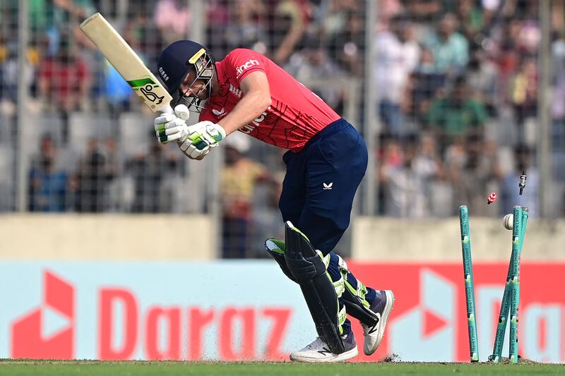 England captain Jos Buttler is clean bowled by Hasan Mahmud for four. AFP