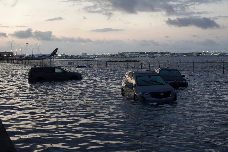 Cars stranded amid the floodwaters near the airport. AP