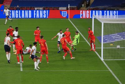 England's Danny Ings, left, no 10, scores during the international friendly soccer match between England and Wales at Wembley stadium in London, Thursday Oct. 8, 2020. England won the match 3-0. (Nick Potts/Pool via AP)