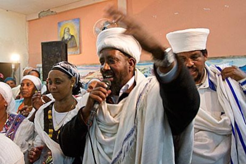 An Ethiopian kess - Amharic for priest - blesses a newly-wed couple in Ashkelon, southern Israel.