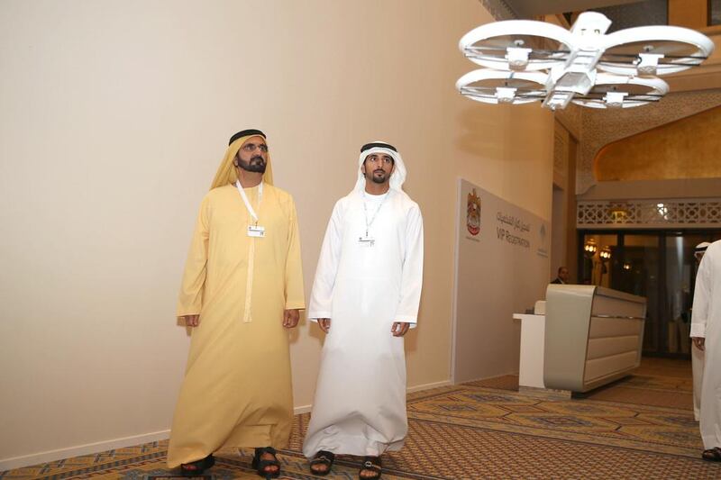 Sheikh Mohammed bin Rashid, prime minister of the UAE and Ruler of Dubai, left, and Sheikh Hamdan bin Mohammed, the Crown Prince of Dubai personally attend testing of a UAV prototype designed to carry parcels. Wam