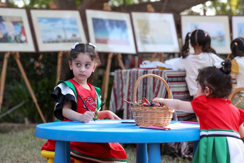 Ajwaan Mansour, 6, wearing her National Day dress in the Kids' Zone at the Heritage Village in Abu Dhabi. Khushnum Bhandari / The National