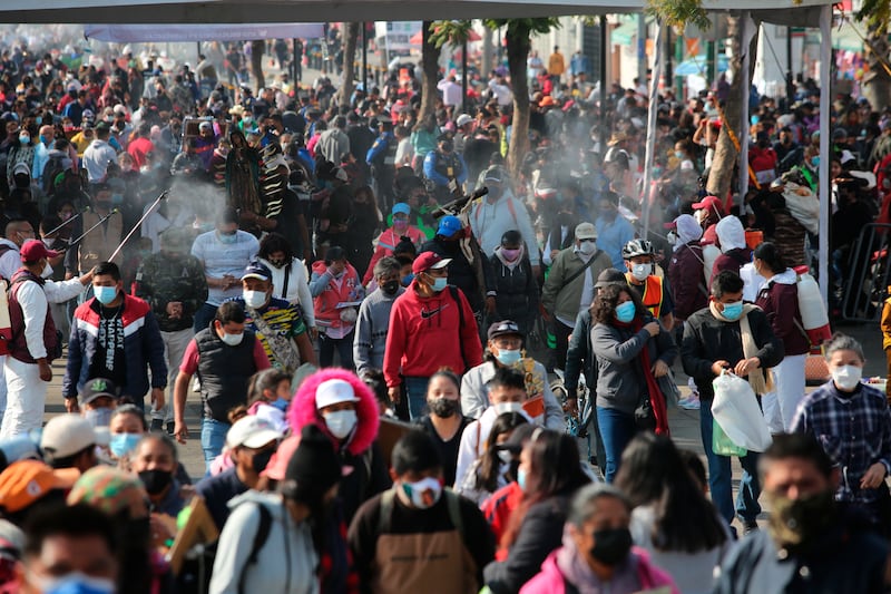 Pilgrims walk towards Our Lady of Guadalupe Basilica in Mexico City on Sunday after the easing of Covid-19 restrictions. AP