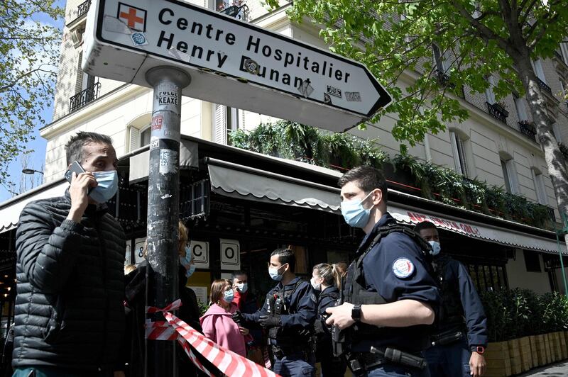 French police cordon off the area near the Henry Dunant private hospital in Paris. AFP