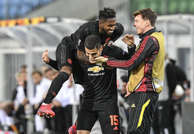 Manchester United's Fred jumps on scorer Andreas Pereira after the fifth. AP