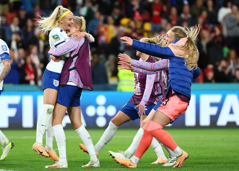 England's Chloe Kelly, left, celebrates after scoring the winning penalty. AP