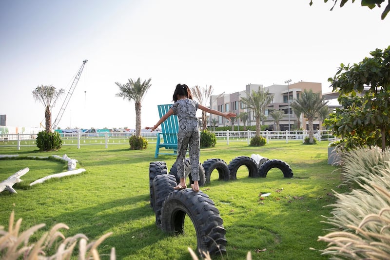DUBAI, UNITED ARAB EMIRATES - JUNE 7, 2018. 

Hannah Khan, 11, plays at the park in Dubai Sustainable City. The park is made up of recyclable material.

A new programme ‘My Hive,’ was launched by The Sustainable City (TSC) in partnership with the Apiculture and Nature for the Betterment of Health and Beauty (ANHB). The programme grants individuals and corporations the opportunity to adopt a beehive of their own.

The programme was launched by Shaikh Salem Sultan Al Qasimi, Chairman of ANHB, after the TSC purchased 250 new beehives to provide residents with organic honey and raise awareness of the important ecological role of bees.

(Photo by Reem Mohammed/The National)

Reporter: Ramola Talwar
Section: NA
