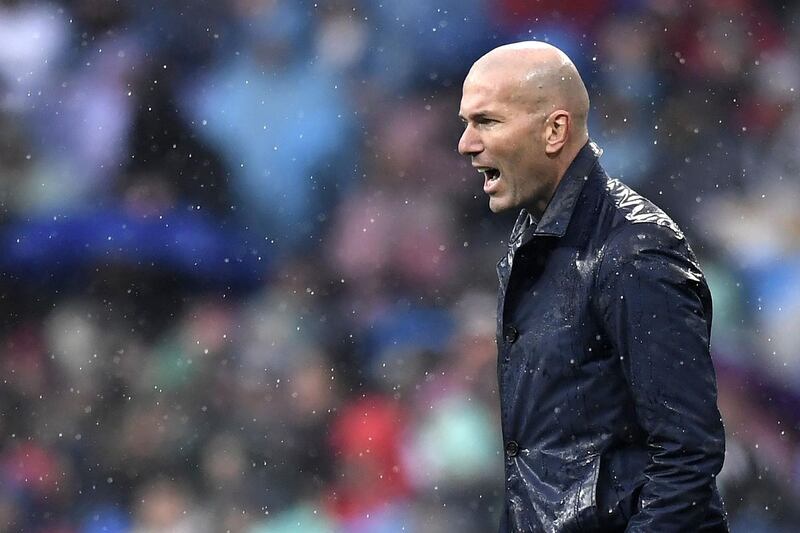 Real Madrid's French coach Zinedine Zidane reacts during the Spanish league football match between Real Madrid and Villarreal at the Santiago Bernabeu Stadium in Madrid on January 13, 2018. / AFP PHOTO / GABRIEL BOUYS