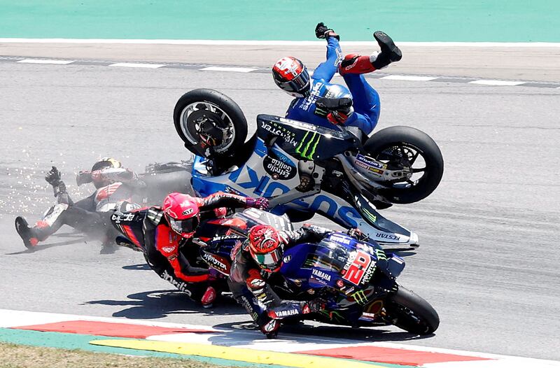 Team Suzuki Ecstar's Alex Rins crashes out at the start of the Catalunya Grand Prix MotoGP race at Circuit de Barcelona, on June 5, 2022. Reuters