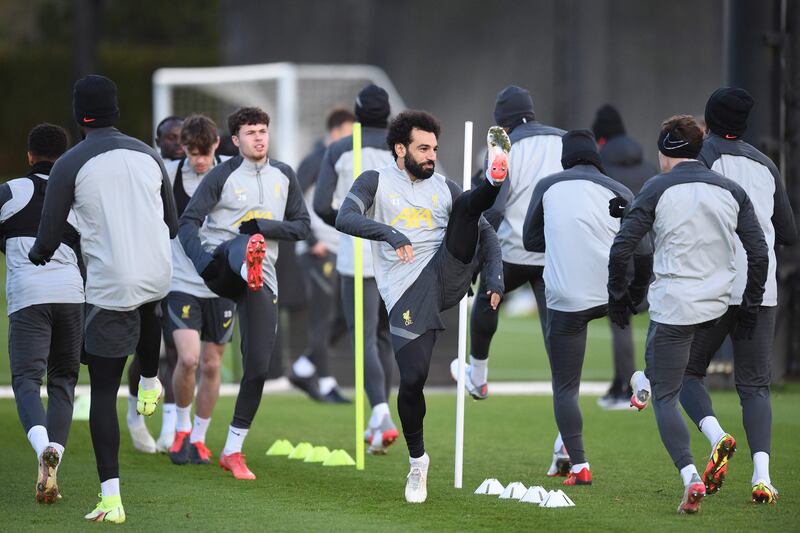 Liverpool's Mohamed Salah warms up with teammates at their training ground. AFP