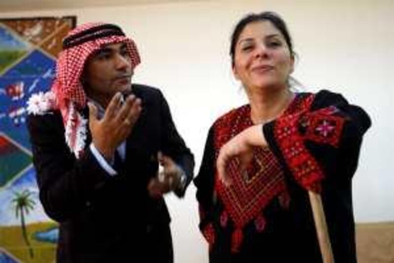 Actors from the Performing Arts Center prform the charachters of Um Jaser and her husband Abu Jaser in Amman, Jordan on June 10, 2009. (Salah Malkawi/ The National)