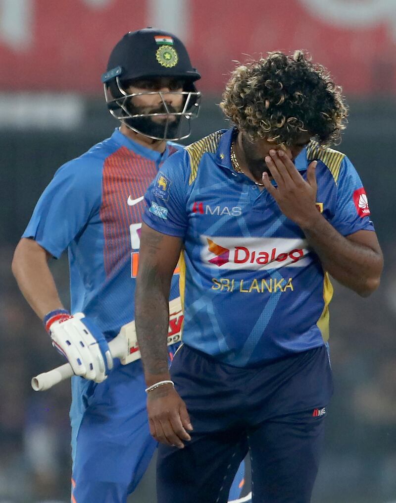 Sri Lanka captain Lasith Malinga, right, and captain Virat Kohli. AP