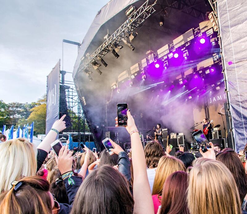 GNRGBJ People at Festival No.6 Music Festival in Portmeirion Village, Gwynedd, Wales, UK using mobile phones to record performers.. Image shot 09/2015. Exact date unknown.