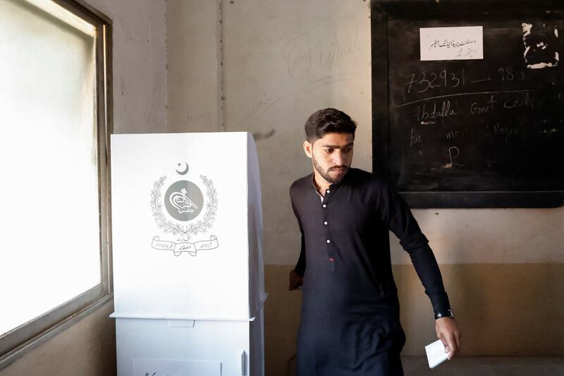 A voter leaves the ballot booth in Karachi. Reuters