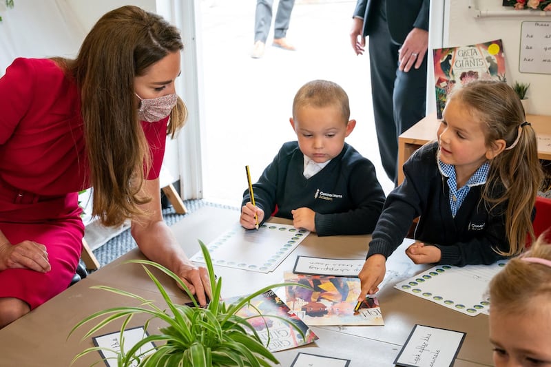 Britain's Catherine, Duchess of Cambridge talks with children in the school's Reception Class as she visits Connor Downs Academy, during G7 Summit, in Hayle, Cornwall, Britain, June 11, 2021. Aaron Chown/PA Wire/Pool via REUTERS
