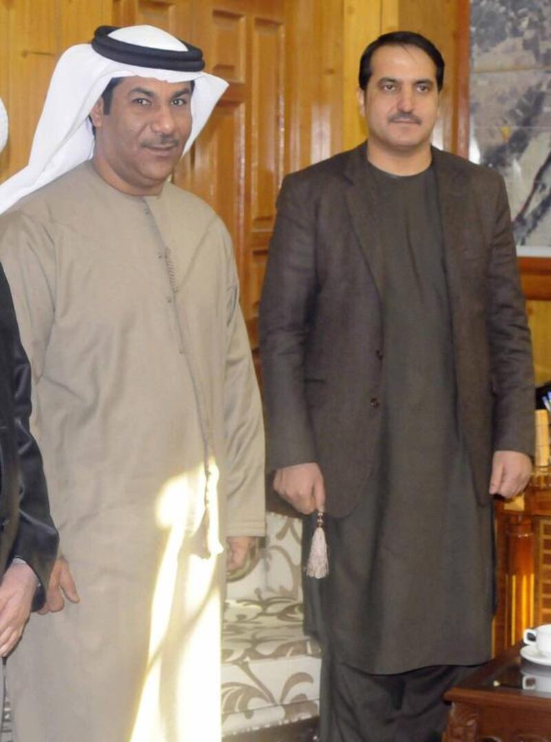 The UAE's ambassador to Afghanistan Juma Al Kaabi, who died from wounds sustained in the Kandahar attack, and Kandahar governor Hamayoun Azizi, who was severely wounded. The picture was taken on January 10, 2017, shortly before the twin blasts. Kandahar Gov Office Handout / EPA