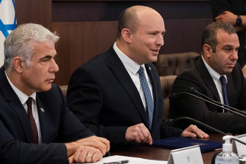 Israeli Prime Minister Naftali Bennett with Foreign Minister Yair Lapid, left, at a Cabinet meeting in Jerusalem. Reuters