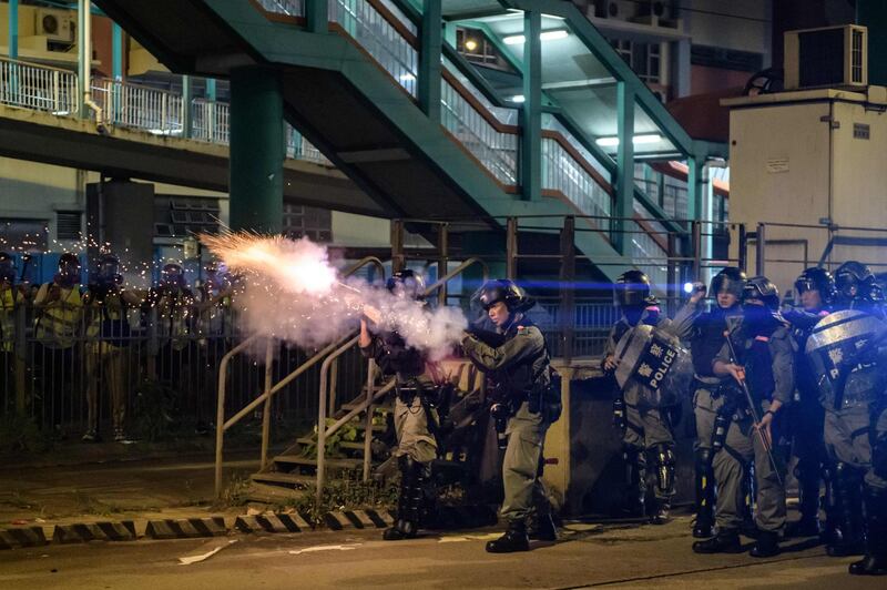 Riot police fire tear gas during a pro-democracy demonstrator in Yuen Long district of Hong Kong. AFP