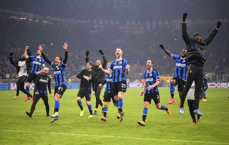 Inter players celebrate after their derby win over AC Milan in Serie A on Sunday, February 9. Reuters