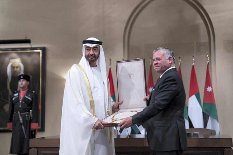 AMMAN, JORDAN - November 20, 2018: HM King Abdullah II, King of Jordan (R) presents Al Hussein Bin Ali Medal, to HH Sheikh Mohamed bin Zayed Al Nahyan Crown Prince of Abu Dhabi Deputy Supreme Commander of the UAE Armed Forces (R), at Al Husseiniya Palace.
( Mohamed Al Hammadi / Ministry of Presidential Affairs )
---