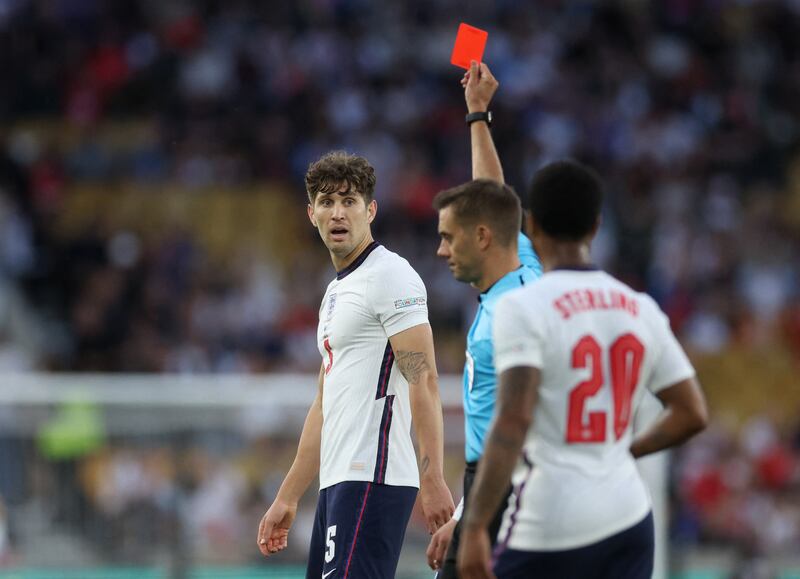 England defender John Stones is shown a red card by referee Clement Turpin. Reuters