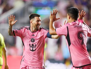 Mar 13, 2024; Fort Lauderdale, FL, USA;  Inter Miami CF forward Lionel Messi (10) celebrates after scoring a goal with forward Luis Suarez (9) against the Nashville SC in the first half during the Concacaf round of sixteen at Chase Stadium.  Mandatory Credit: Nathan Ray Seebeck-USA TODAY Sports